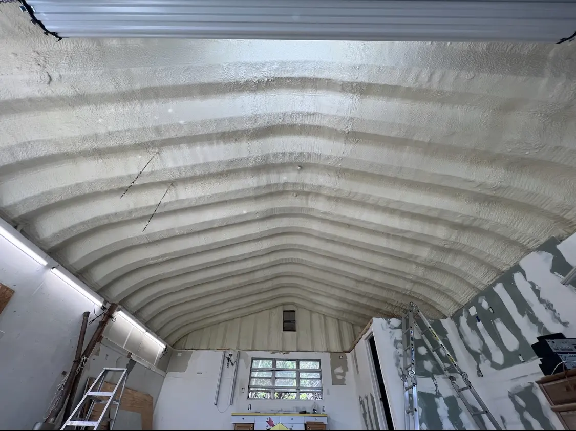 Spray polyurethane foam applied to the underside of a metal roof deck in Phenix City